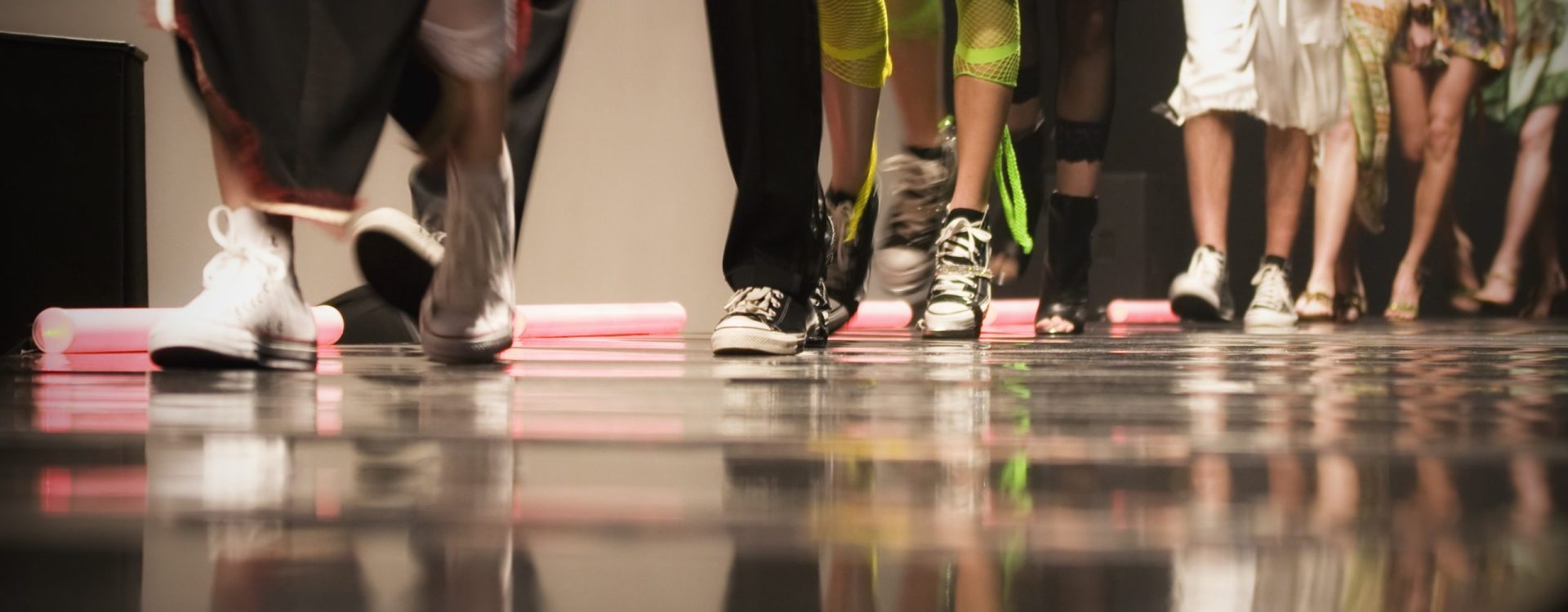 Fashion show with models on stage.