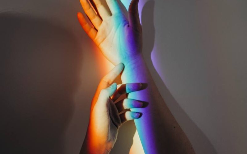Persons Hands With Rainbow Colors