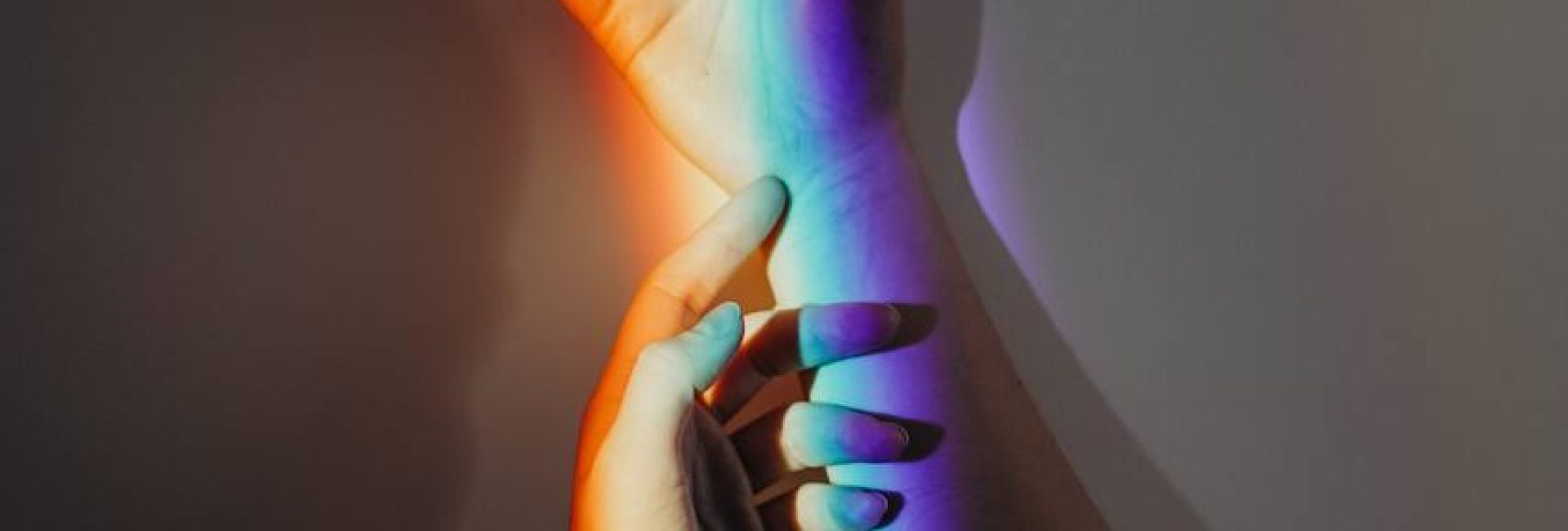 Persons Hands With Rainbow Colors